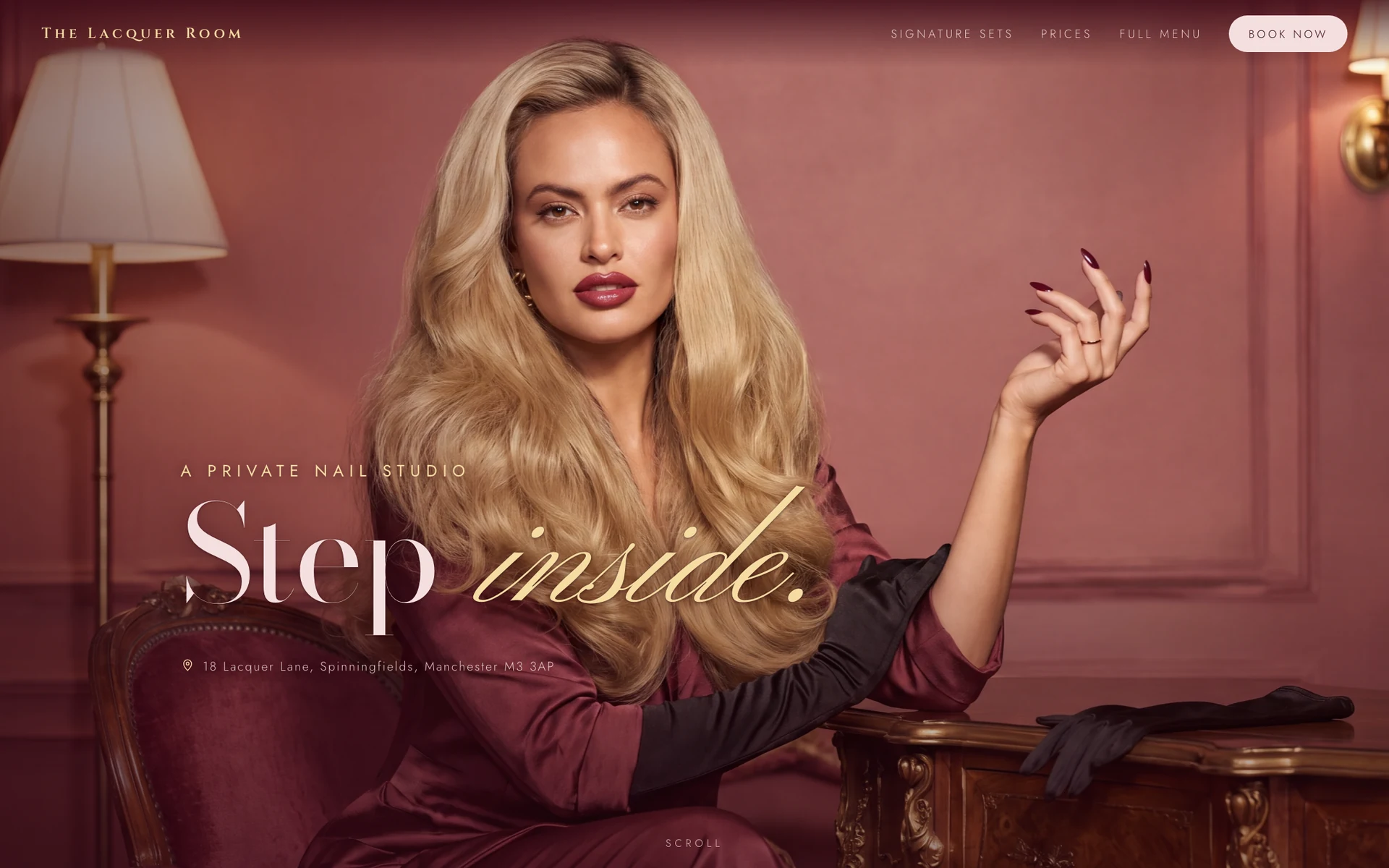 The Lacquer Room homepage: the owner seated in a rose-panelled room, raising a hand with burgundy nails, with the words Step inside